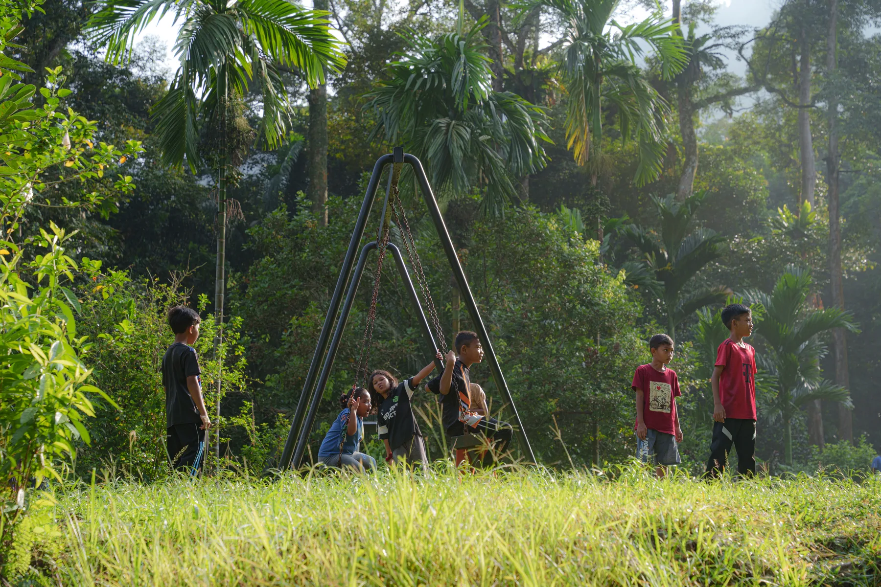Village children playing outdoors in the morning light