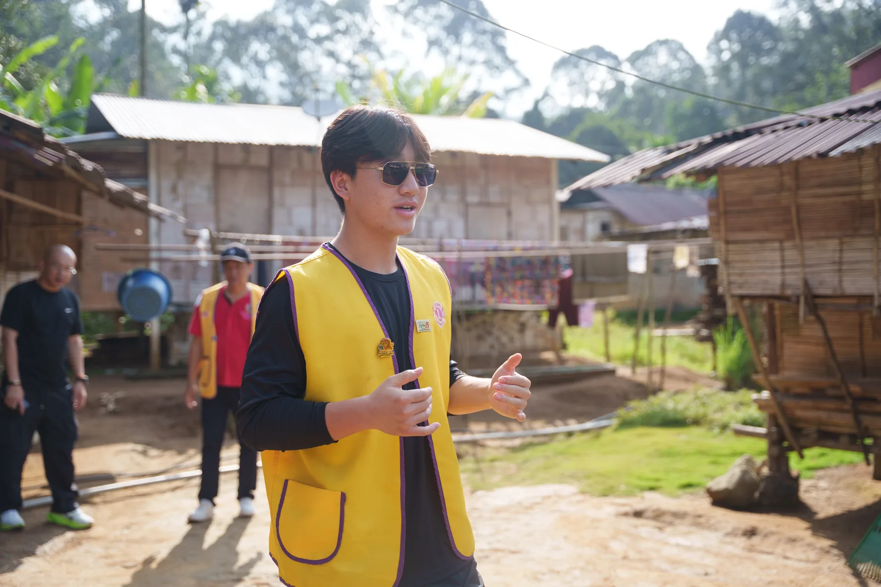 Louie speaking during a visit through the village