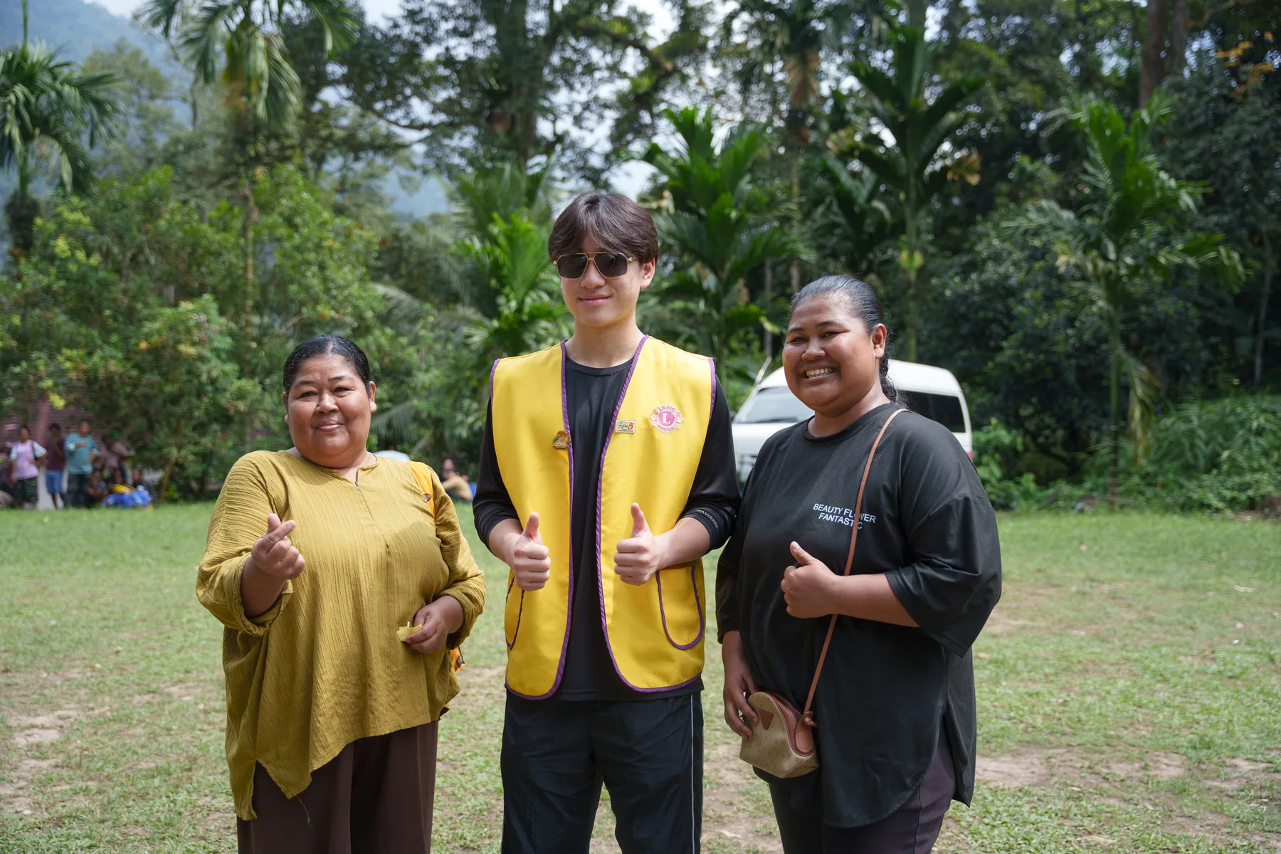 Louie standing with two women from the village community