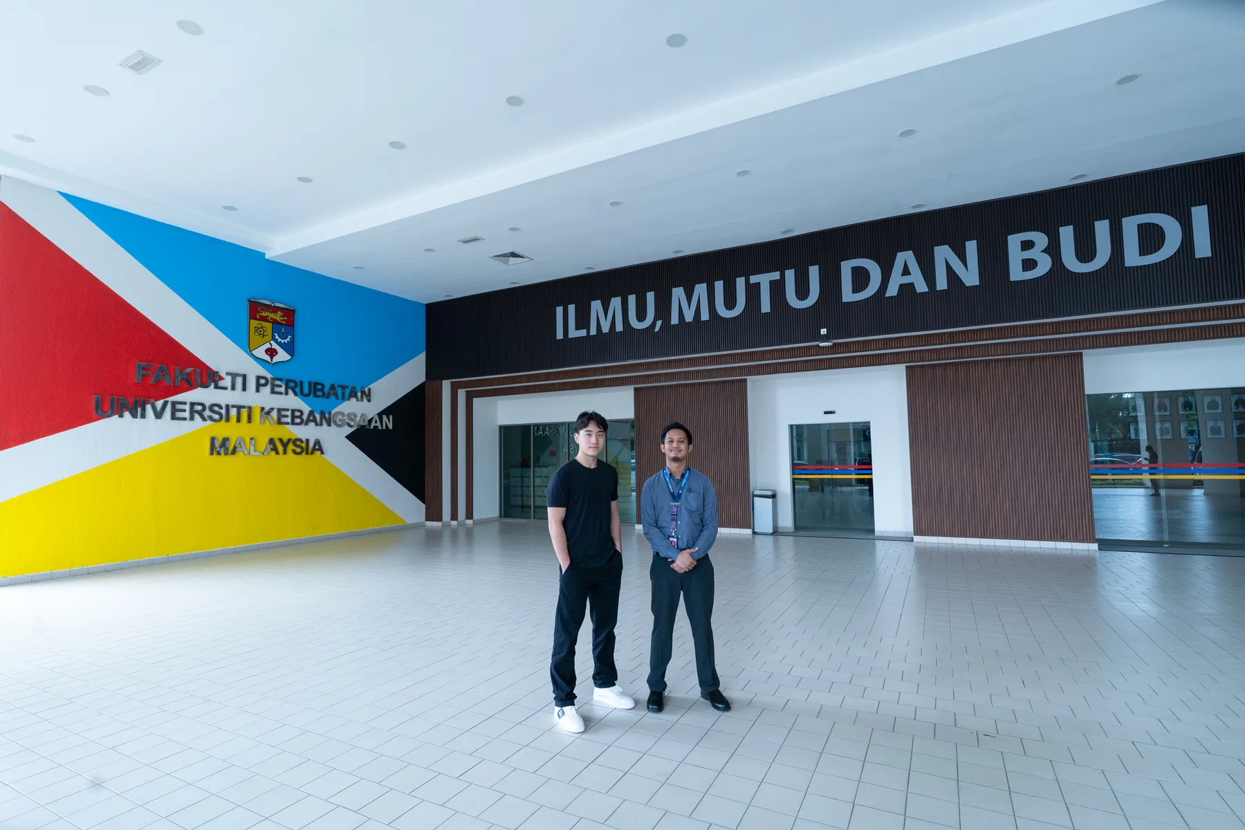 Louie and a UKM representative outside the Faculty of Medicine
