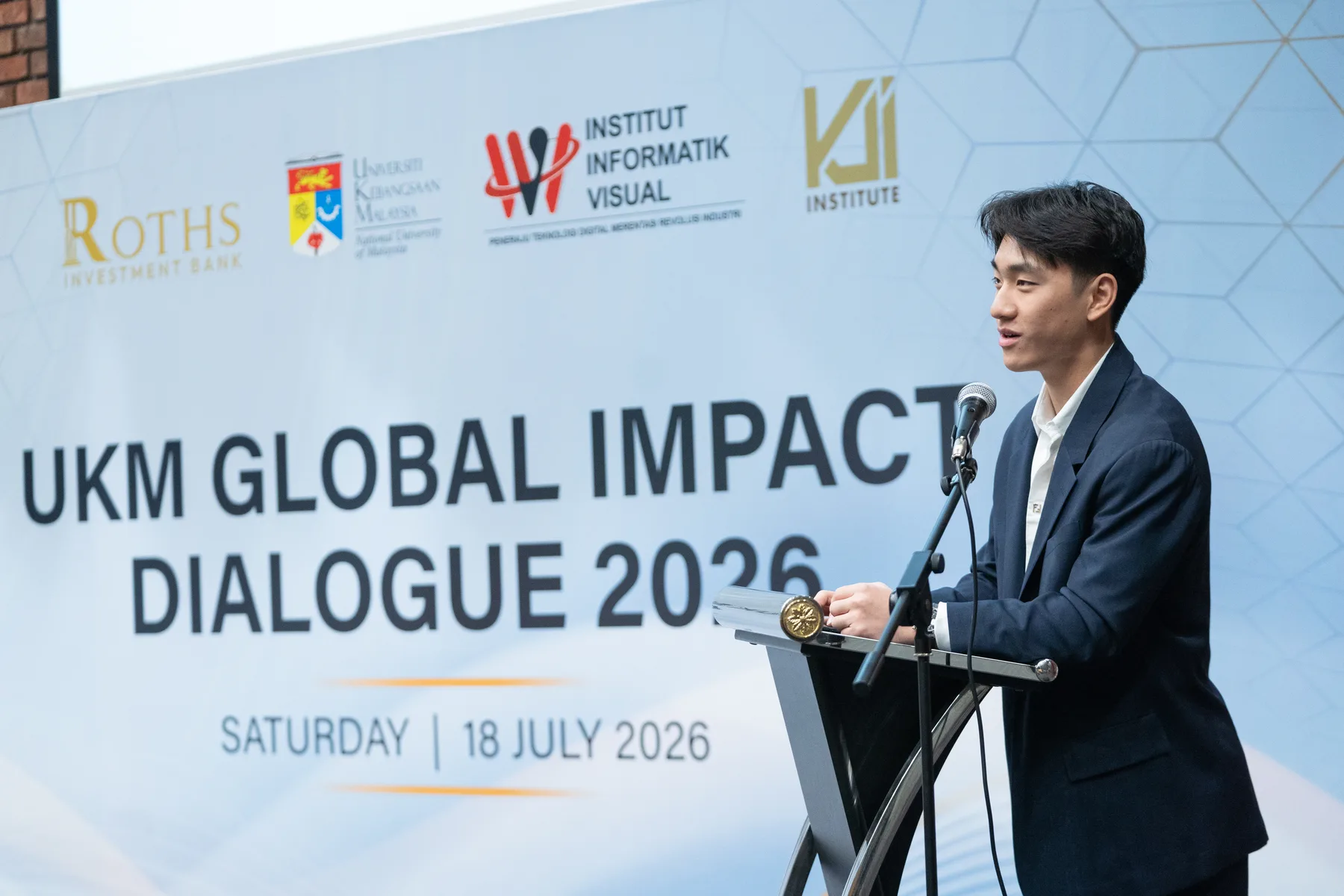 Louie Liu speaking at the UKM Global Impact Dialogue lectern