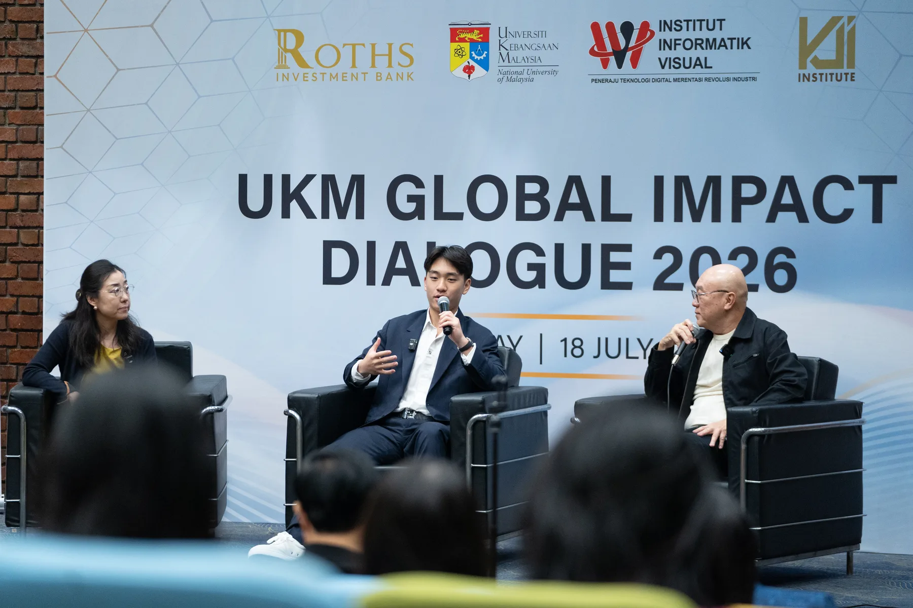 Louie Liu speaking during a panel discussion at UKM