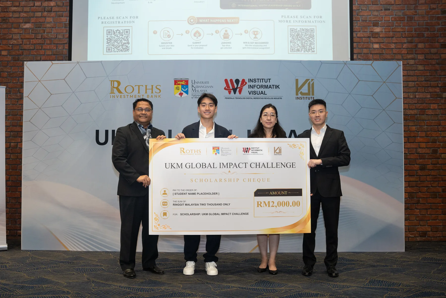 UKM Global Impact Challenge representatives presenting a scholarship cheque