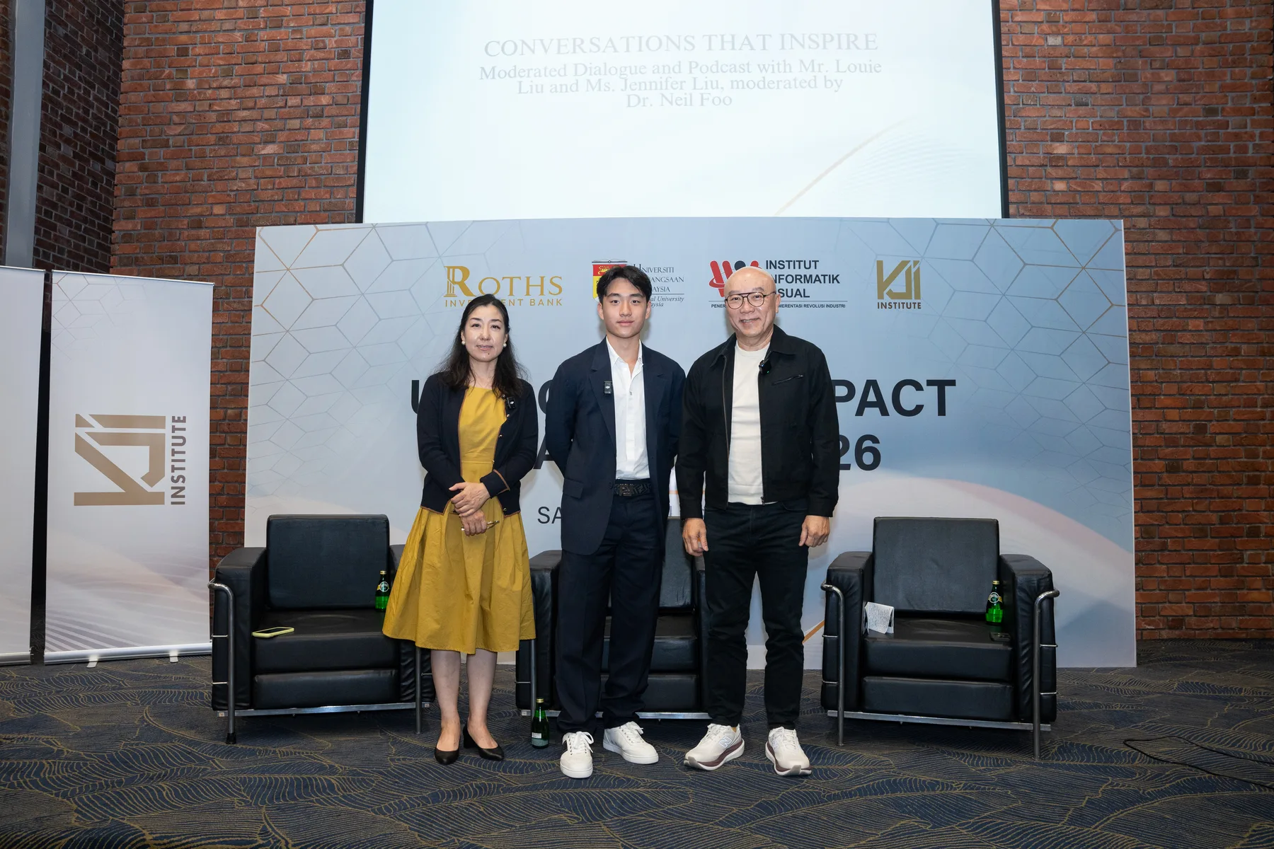 Louie Liu and partners gathered on the Global Impact Dialogue stage