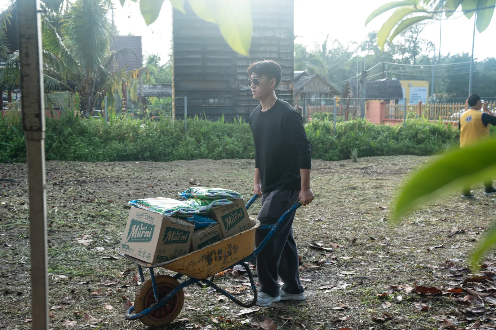 Volunteers walking between village homes during the outreach