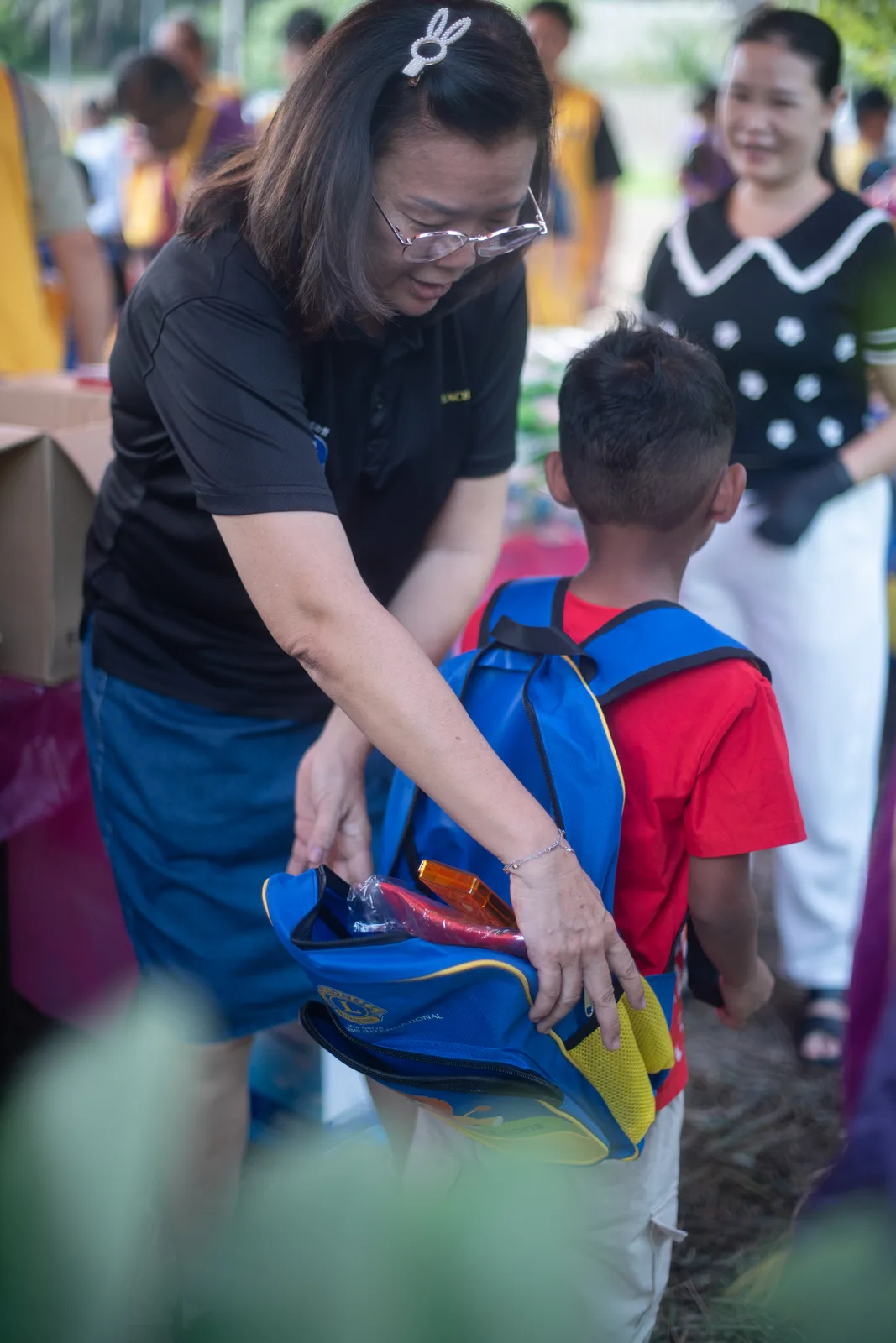 A healthcare volunteer checking a child's health