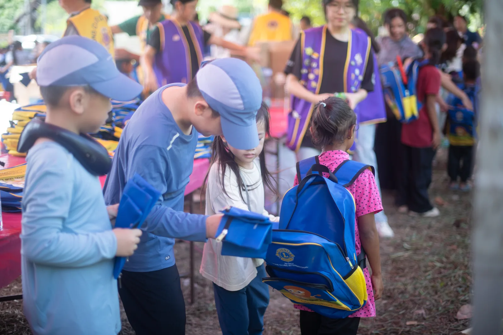Volunteers preparing nutritional supplies under the outreach tent